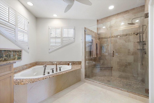 bathroom featuring vanity, shower with separate bathtub, and ceiling fan