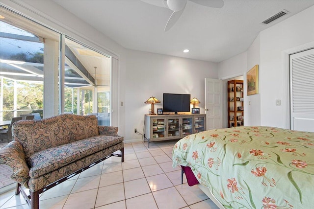 bedroom featuring ceiling fan, light tile patterned floors, and access to outside