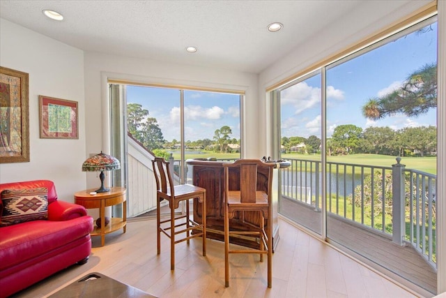 sunroom with a water view