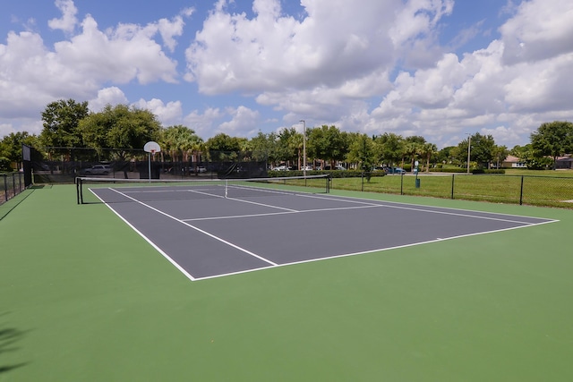 view of sport court with basketball hoop