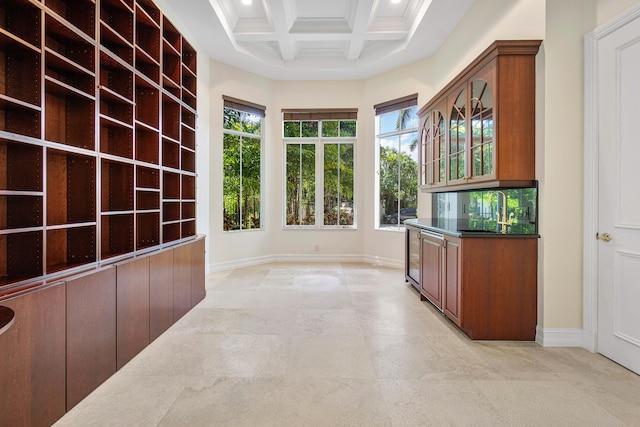 interior space with beamed ceiling and coffered ceiling