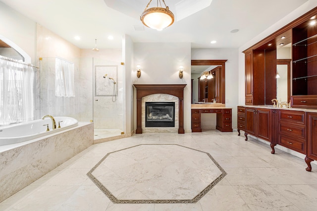 bathroom featuring vanity and separate shower and tub