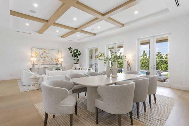 dining room with coffered ceiling, beam ceiling, and french doors