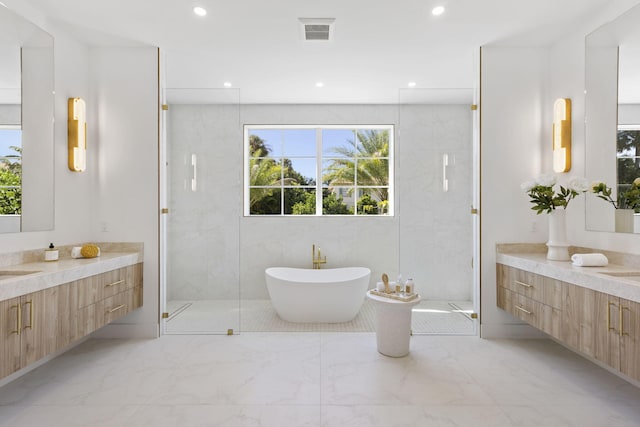 bathroom with vanity, tile walls, and plus walk in shower