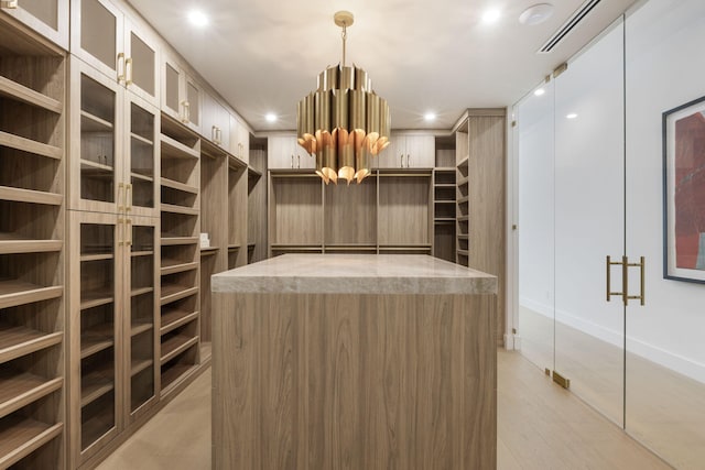 walk in closet featuring light wood-type flooring