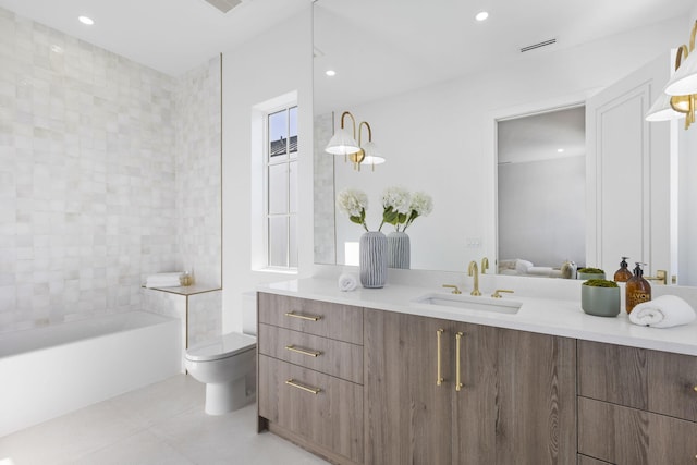 bathroom featuring vanity, toilet, and tile patterned flooring