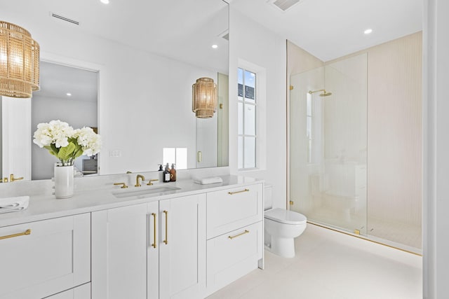 bathroom featuring vanity, toilet, walk in shower, and tile patterned flooring