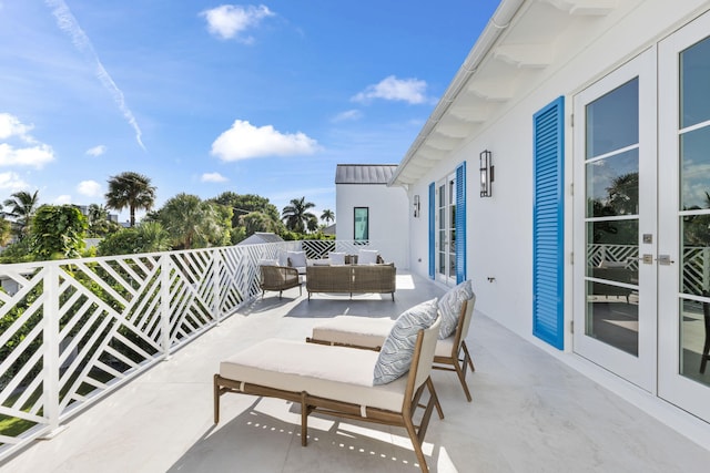 view of patio with an outdoor living space and french doors