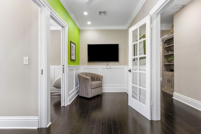 living area featuring ornamental molding and dark hardwood / wood-style floors