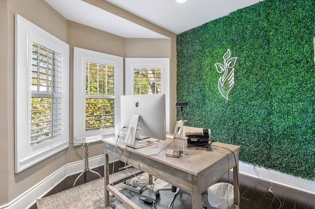 office space with dark wood-type flooring and plenty of natural light