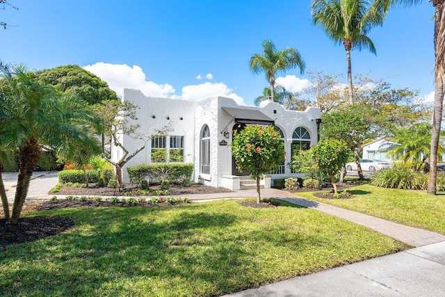 view of front of home with a front yard