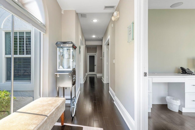 corridor featuring dark hardwood / wood-style flooring