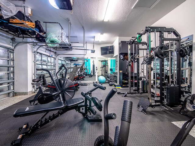 gym with a textured ceiling