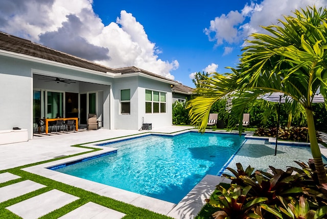 view of pool with ceiling fan and a patio area