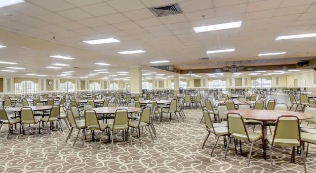 dining area with a drop ceiling