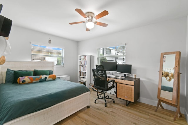 bedroom featuring wood-type flooring and ceiling fan