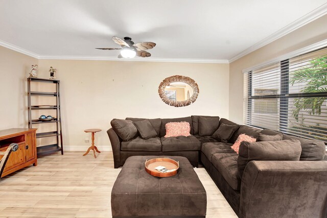 living room featuring crown molding, light hardwood / wood-style flooring, and ceiling fan