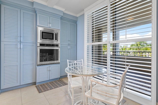 tiled dining space with crown molding