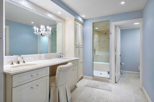 bathroom with vanity, toilet, and an enclosed shower