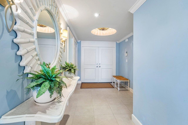 interior space with crown molding and light tile patterned flooring