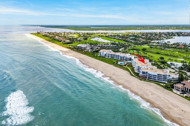 bird's eye view featuring a view of the beach and a water view