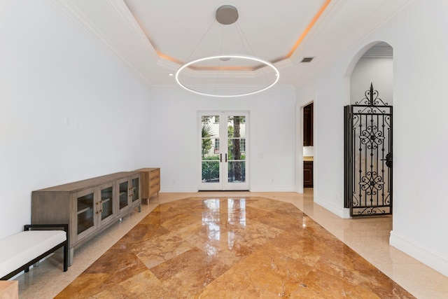 13058 Flamingo Ter, Palm Beach Gardens, FL 33410 - unfurnished room featuring ornamental molding, arched walkways, marble tiled floors, french doors, and baseboards