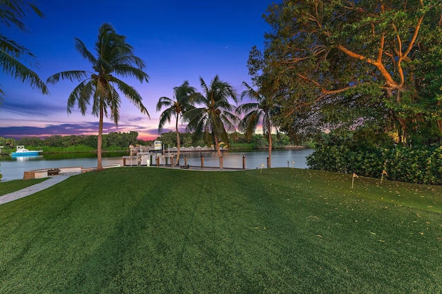 13058 Flamingo Ter, Palm Beach Gardens, FL 33410 - view of green lawn featuring a water view and a putting area