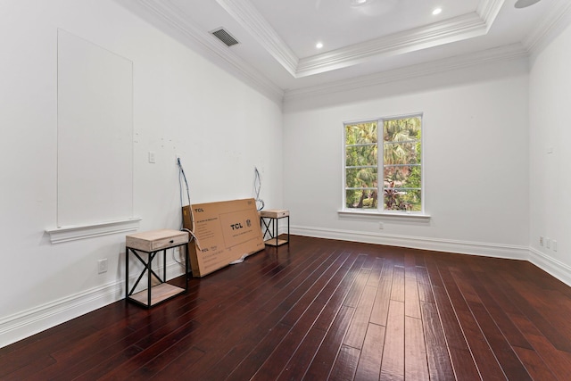 13058 Flamingo Ter, Palm Beach Gardens, FL 33410 - empty room featuring hardwood / wood-style flooring, a raised ceiling, crown molding, and baseboards