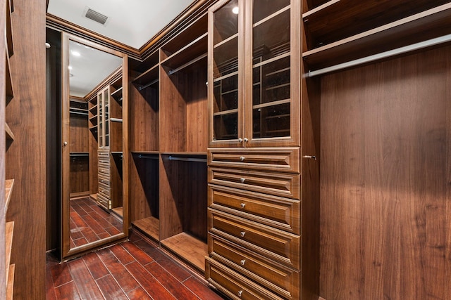 walk in closet featuring dark hardwood / wood-style floors