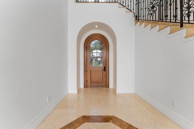 foyer with a towering ceiling