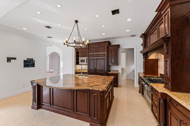 13058 Flamingo Ter, Palm Beach Gardens, FL 33410 - kitchen featuring a sink, built in appliances, baseboards, recessed lighting, and crown molding