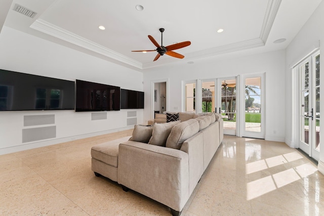 living room featuring ceiling fan, a wealth of natural light, and french doors