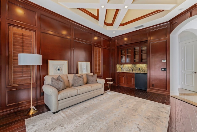 13058 Flamingo Ter, Palm Beach Gardens, FL 33410 - living area with arched walkways, dark wood-type flooring, coffered ceiling, recessed lighting, and beamed ceiling