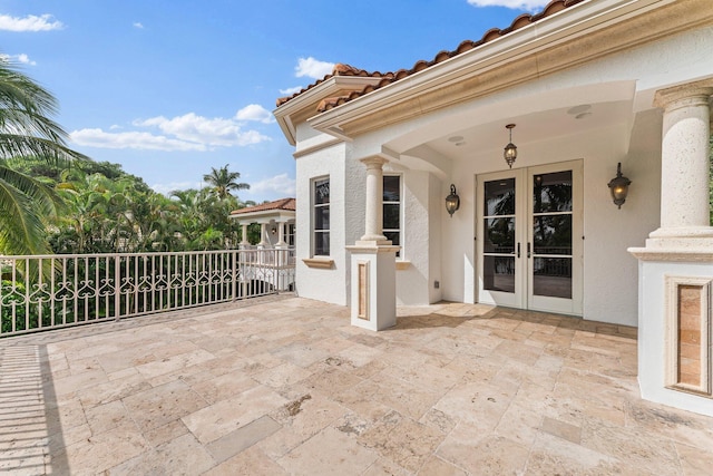 13058 Flamingo Ter, Palm Beach Gardens, FL 33410 - view of patio with french doors