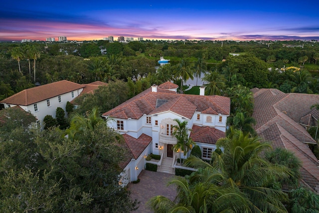 aerial view at dusk with a water view