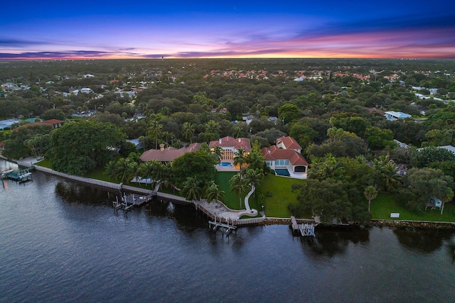 aerial view at dusk with a water view