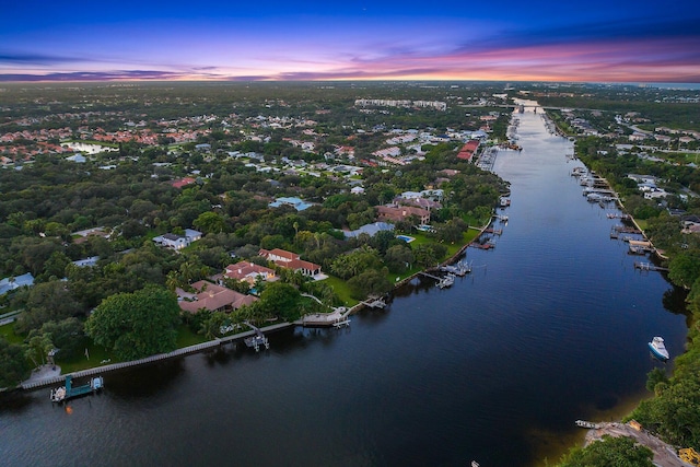 aerial view at dusk with a water view