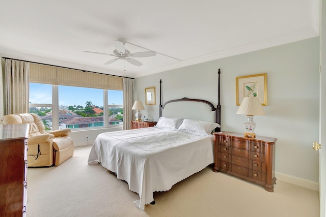 bedroom with light colored carpet, ceiling fan, and ornamental molding