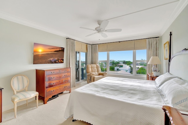 carpeted bedroom featuring ceiling fan and ornamental molding