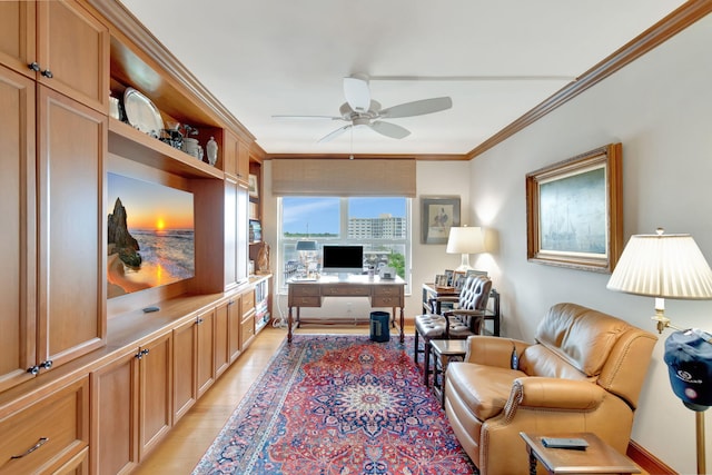 office area featuring ceiling fan, light hardwood / wood-style floors, and ornamental molding