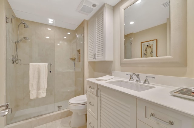 bathroom with an enclosed shower, vanity, toilet, and tile patterned floors