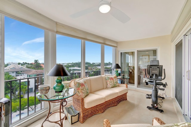 sunroom / solarium with a wealth of natural light and ceiling fan