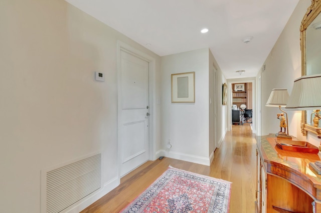 hall with light hardwood / wood-style floors