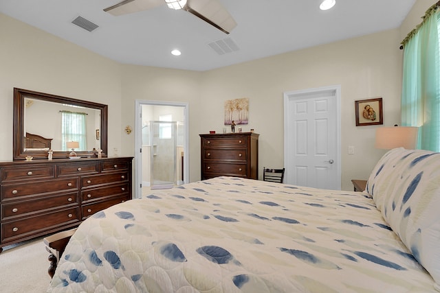 bedroom featuring connected bathroom, carpet floors, and ceiling fan