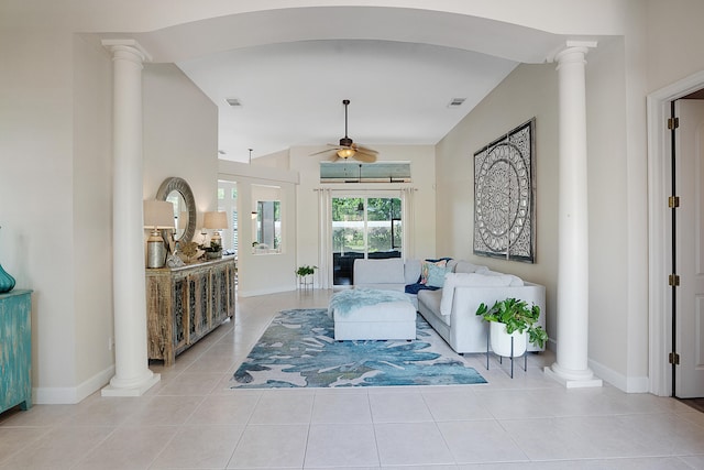 living room featuring ceiling fan and light tile patterned floors