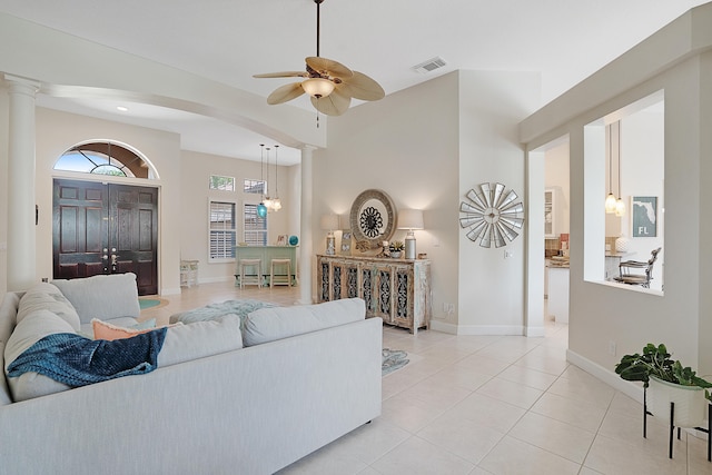 living room featuring ceiling fan and light tile patterned floors