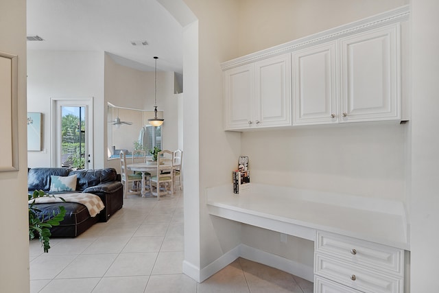 home office with light tile patterned floors