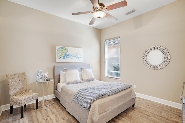 bedroom featuring light hardwood / wood-style floors and ceiling fan