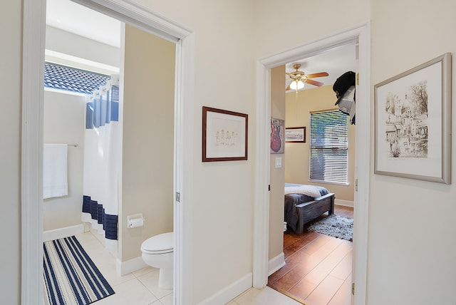 hallway featuring light tile patterned floors