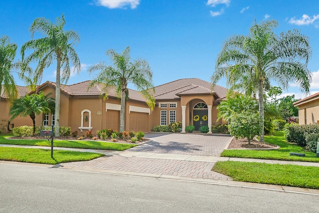 mediterranean / spanish-style house featuring a garage